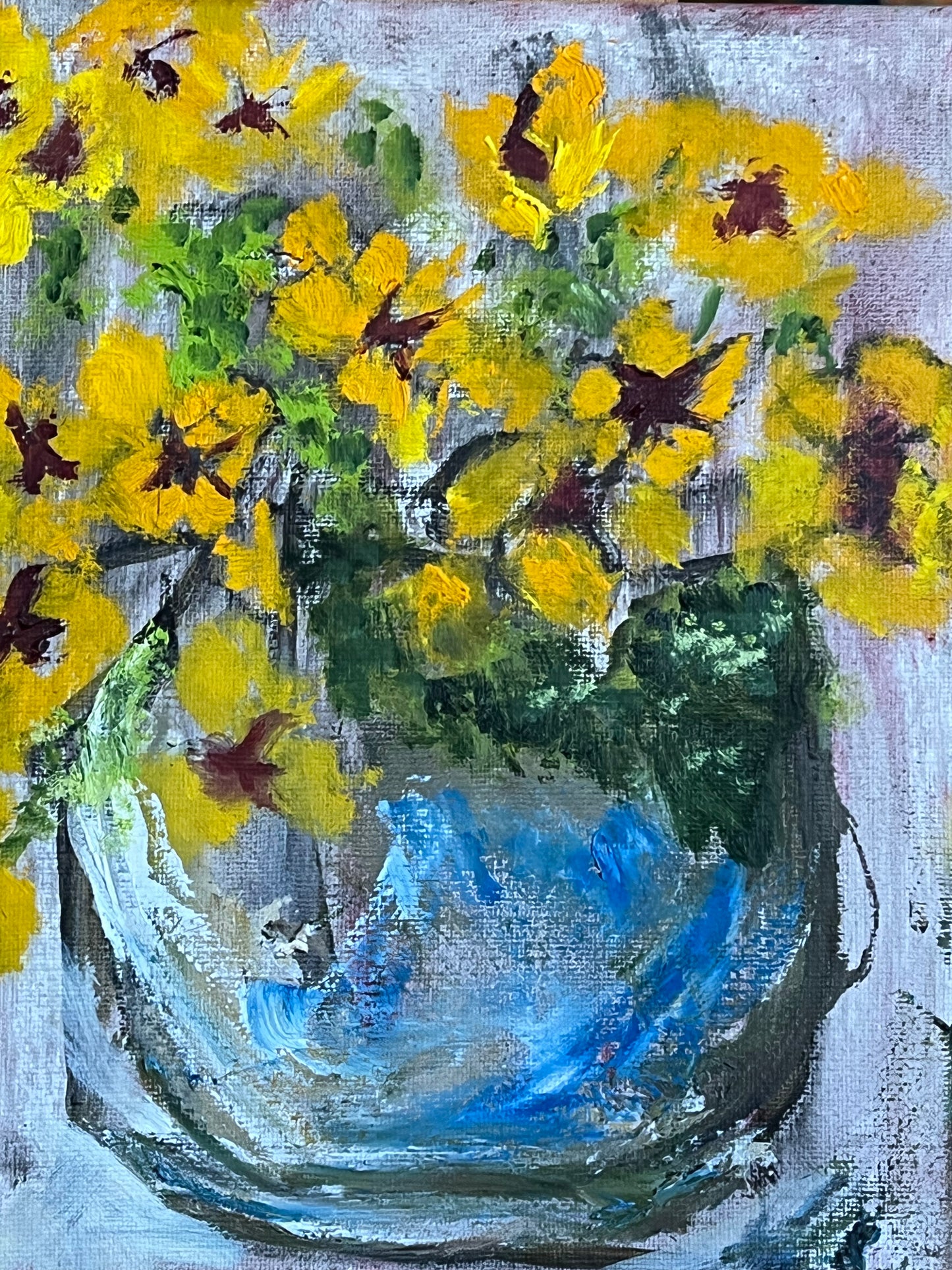 Pansies in a blue vase